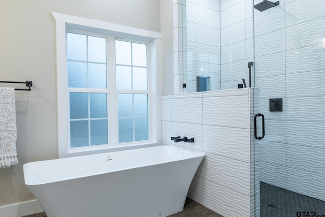 bathroom featuring plus walk in shower