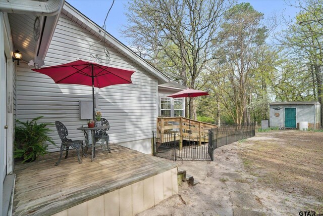 381 Knollwood Ln, Holly Lake Ranch, TX 75765 - wooden terrace featuring an outdoor structure