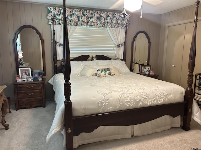 7892 Lakeshore Dr, Tyler, TX 75707 - carpeted bedroom featuring wood walls and a closet