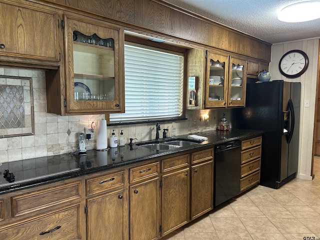 7892 Lakeshore Dr, Tyler, TX 75707 - kitchen with black appliances, tasteful backsplash, light tile patterned floors, glass insert cabinets, and a textured ceiling