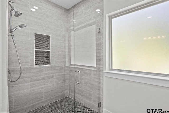 bathroom featuring an enclosed shower