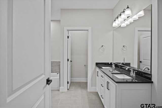 bathroom with vanity and tile patterned flooring