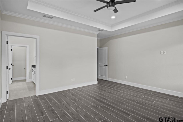 unfurnished room with dark hardwood / wood-style flooring, ceiling fan, and crown molding