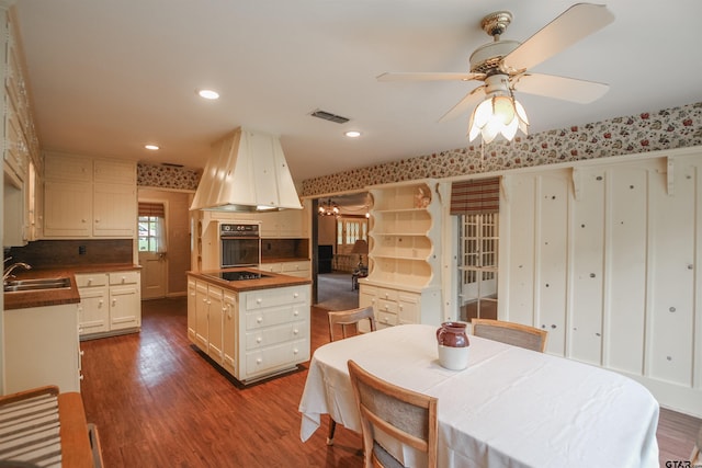 2115 Heather Ln, Tyler, TX 75703 - kitchen with black appliances, premium range hood, a sink, dark wood finished floors, and a ceiling fan