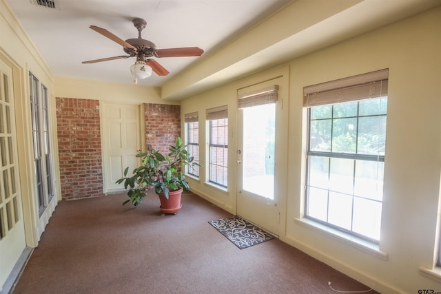2115 Heather Ln, Tyler, TX 75703 - sunroom / solarium with healthy amount of natural light, carpet, and brick wall
