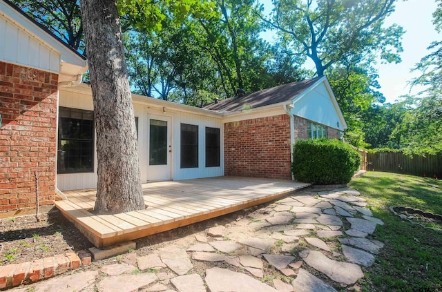 2115 Heather Ln, Tyler, TX 75703 - rear view of house with a deck and brick siding