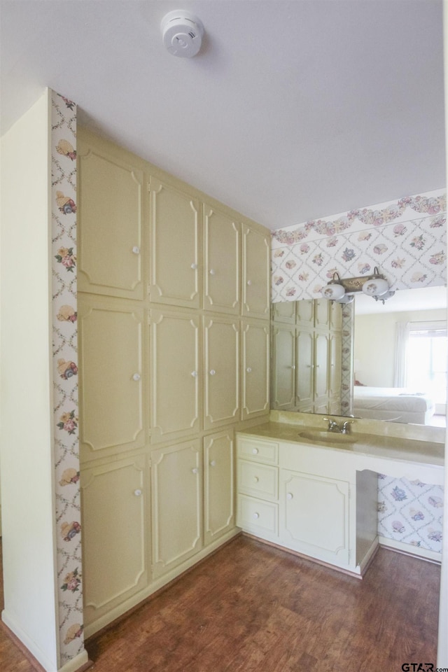 2115 Heather Ln, Tyler, TX 75703 - bathroom featuring wood finished floors and vanity
