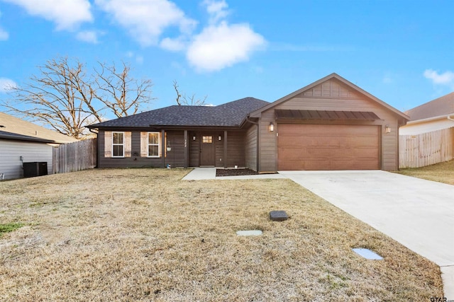 ranch-style house with a garage and a front yard