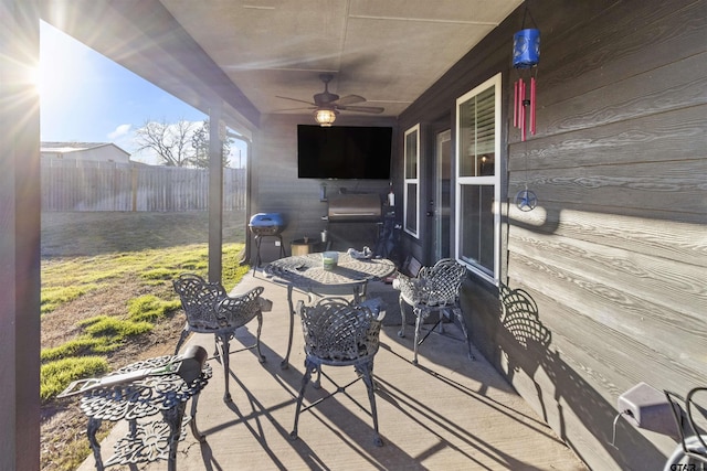 view of patio with grilling area and ceiling fan