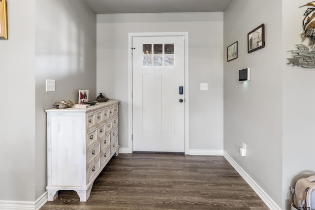 foyer with dark hardwood / wood-style floors