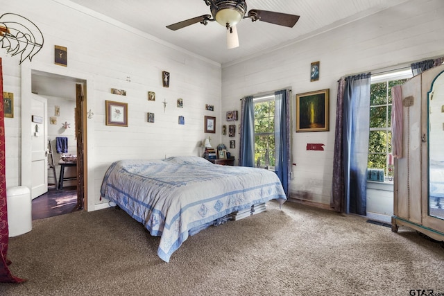 bedroom featuring ceiling fan, crown molding, and carpet floors