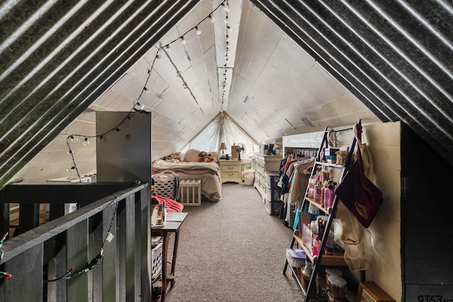 carpeted bedroom with lofted ceiling