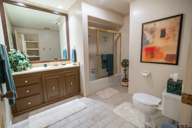 full bathroom with enclosed tub / shower combo, vanity, crown molding, and toilet