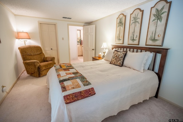 bedroom with crown molding, light colored carpet, a textured ceiling, and a closet