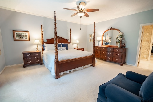 bedroom featuring crown molding, light colored carpet, and ceiling fan