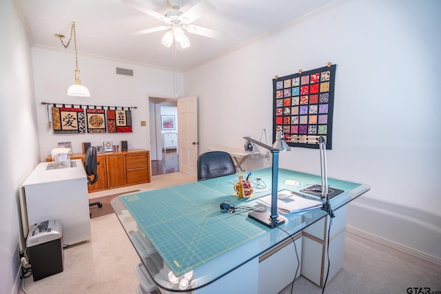 office area with crown molding, light carpet, and ceiling fan