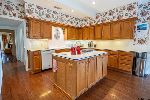 kitchen featuring sink, a center island, dark hardwood / wood-style floors, white dishwasher, and beam ceiling