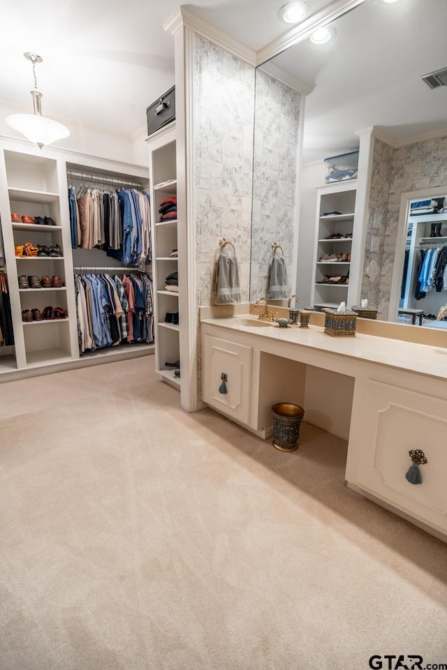 bathroom featuring ornamental molding and vanity