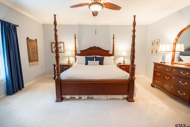 carpeted bedroom featuring ornamental molding and ceiling fan