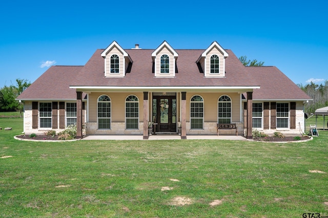 cape cod house with a porch and a front lawn