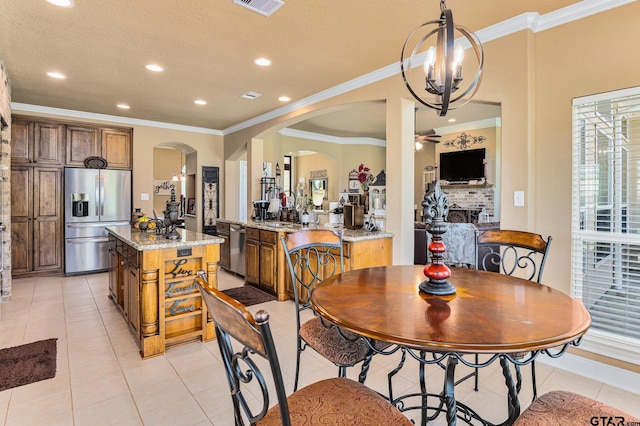 909 Crk 3045, Crockett, TX 75835 - dining room with arched walkways, ornamental molding, light tile patterned flooring, recessed lighting, and ceiling fan