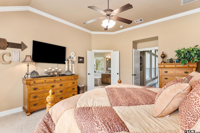 carpeted bedroom featuring connected bathroom, ornamental molding, vaulted ceiling, and ceiling fan