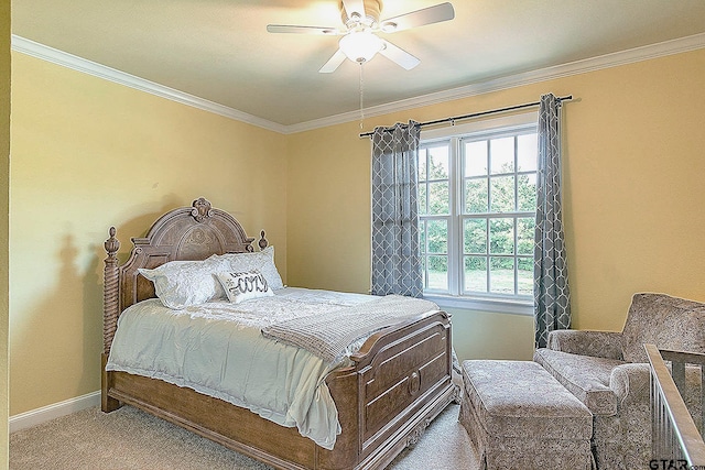 carpeted bedroom featuring ceiling fan and ornamental molding