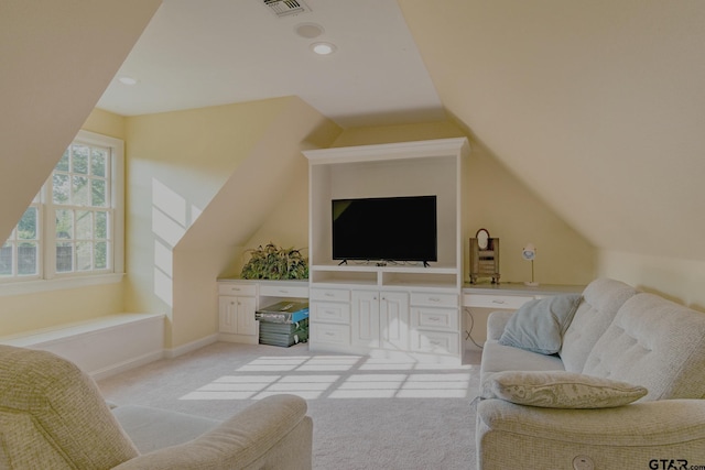 carpeted living room featuring lofted ceiling