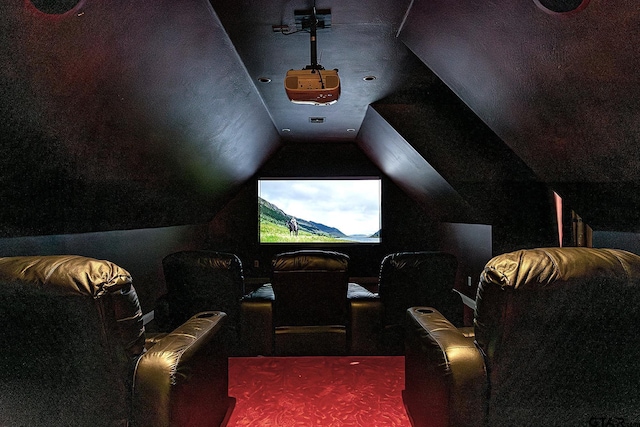 cinema room with vaulted ceiling