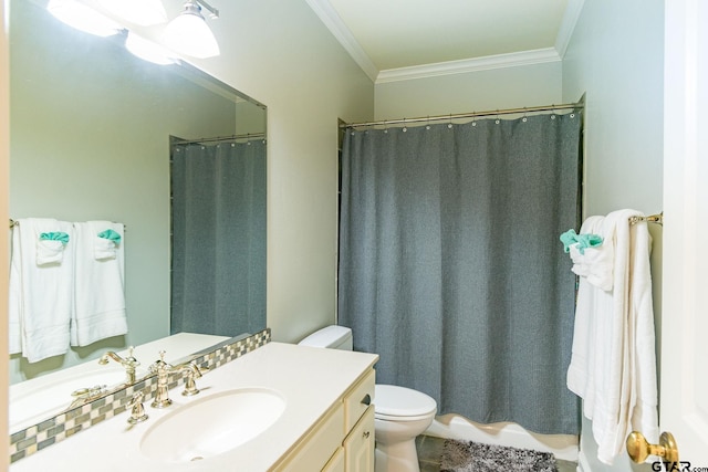 bathroom featuring crown molding, vanity, and toilet