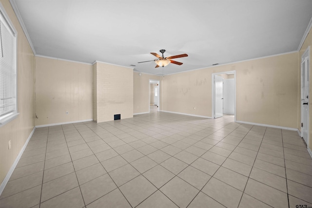 tiled spare room with ornamental molding and ceiling fan