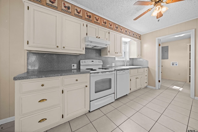 kitchen featuring white appliances, a textured ceiling, light tile patterned flooring, and white cabinets