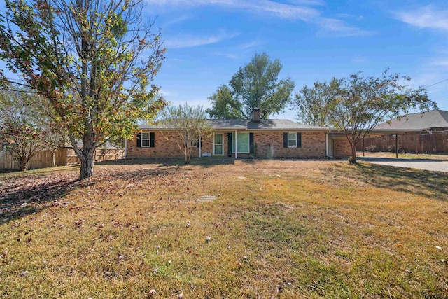 single story home with a front lawn