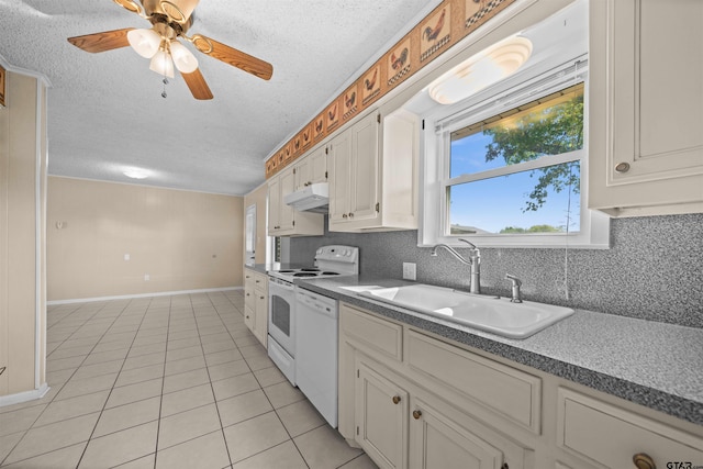 kitchen with sink, ceiling fan, light tile patterned flooring, white cabinetry, and white appliances