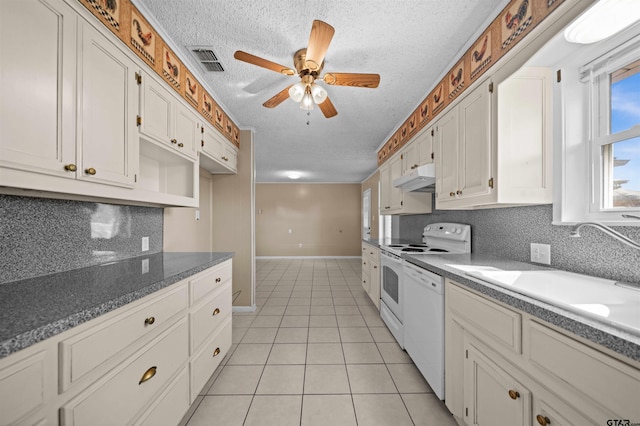 kitchen featuring white cabinetry, sink, a textured ceiling, light tile patterned floors, and white appliances