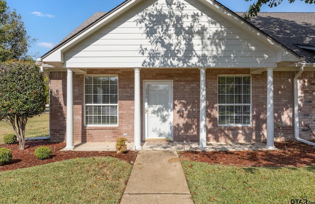 bungalow-style house featuring a porch and a front yard