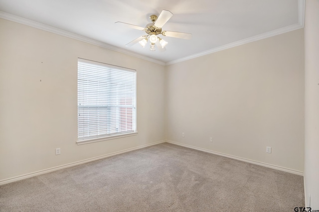 empty room featuring ceiling fan, light colored carpet, and ornamental molding