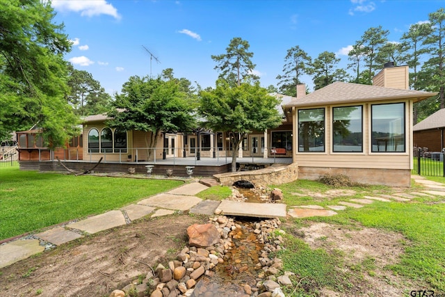 89 Eagle Cv, Mount Vernon, TX 75457 - back of house featuring a chimney and a lawn