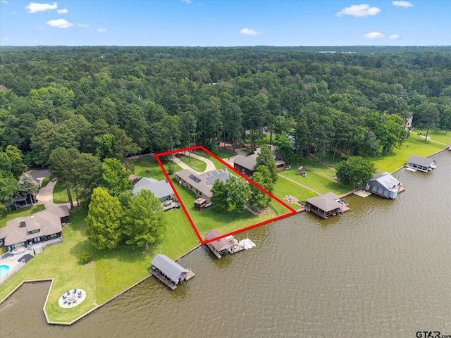 89 Eagle Cv, Mount Vernon, TX 75457 - aerial overview of property's location with a forest, a nearby body of water, and property boundaries highlighted