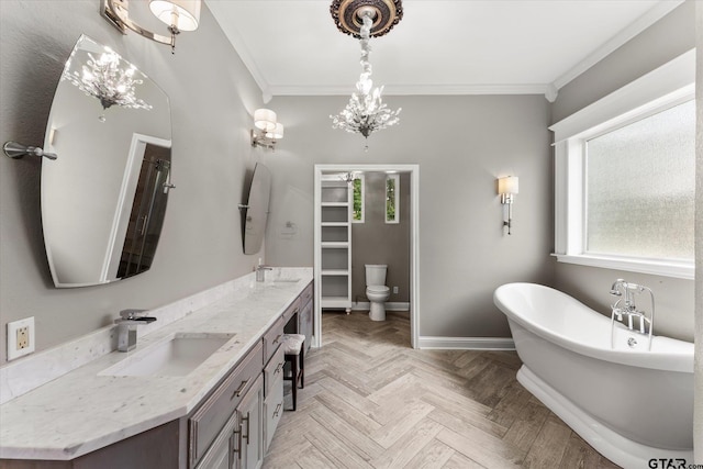 89 Eagle Cv, Mount Vernon, TX 75457 - full bathroom featuring ornamental molding, double vanity, a soaking tub, baseboards, and toilet