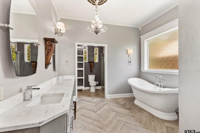 bathroom with toilet, a washtub, parquet floors, and crown molding