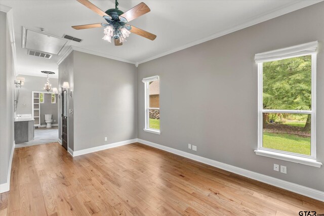 89 Eagle Cv, Mount Vernon, TX 75457 - empty room featuring ornamental molding, healthy amount of natural light, light wood-type flooring, baseboards, and a ceiling fan