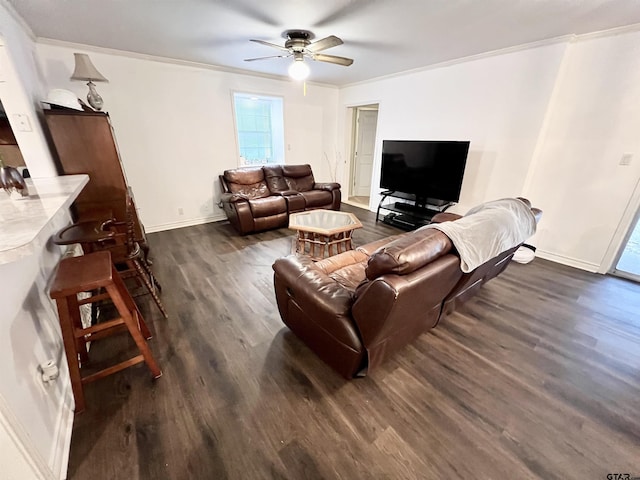 living room with ceiling fan, dark wood-type flooring, and crown molding