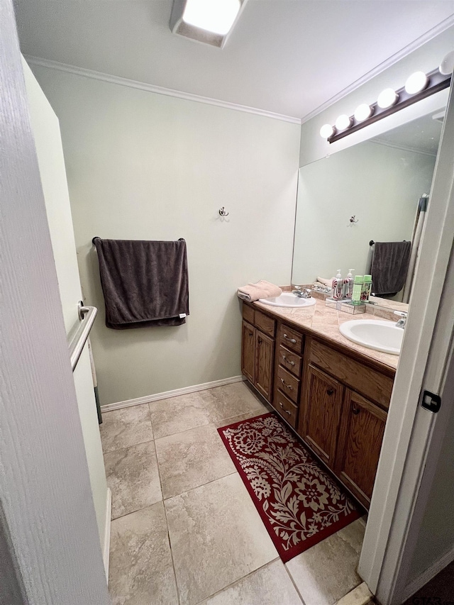 bathroom with tile patterned floors, vanity, and ornamental molding