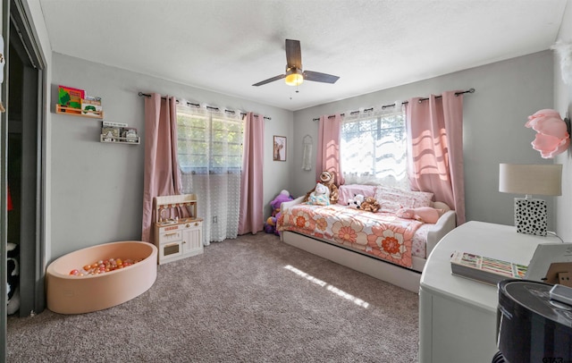 bedroom featuring ceiling fan and carpet floors