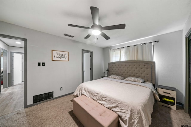 bedroom with light wood-type flooring and ceiling fan