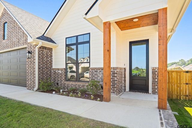 doorway to property featuring a garage