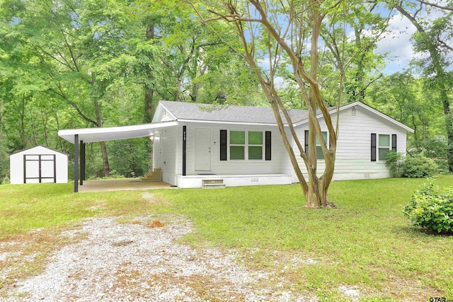 view of front of house with an outbuilding, driveway, crawl space, and a storage unit