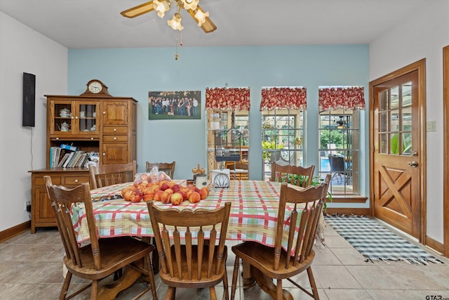 tiled dining room with ceiling fan