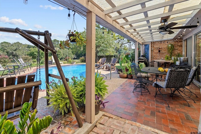 view of patio / terrace with ceiling fan and a pergola